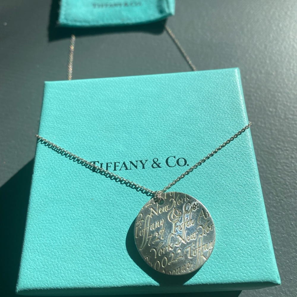 Tiffany & Co. “Love Notes” Necklace 1” silver wavy disk.